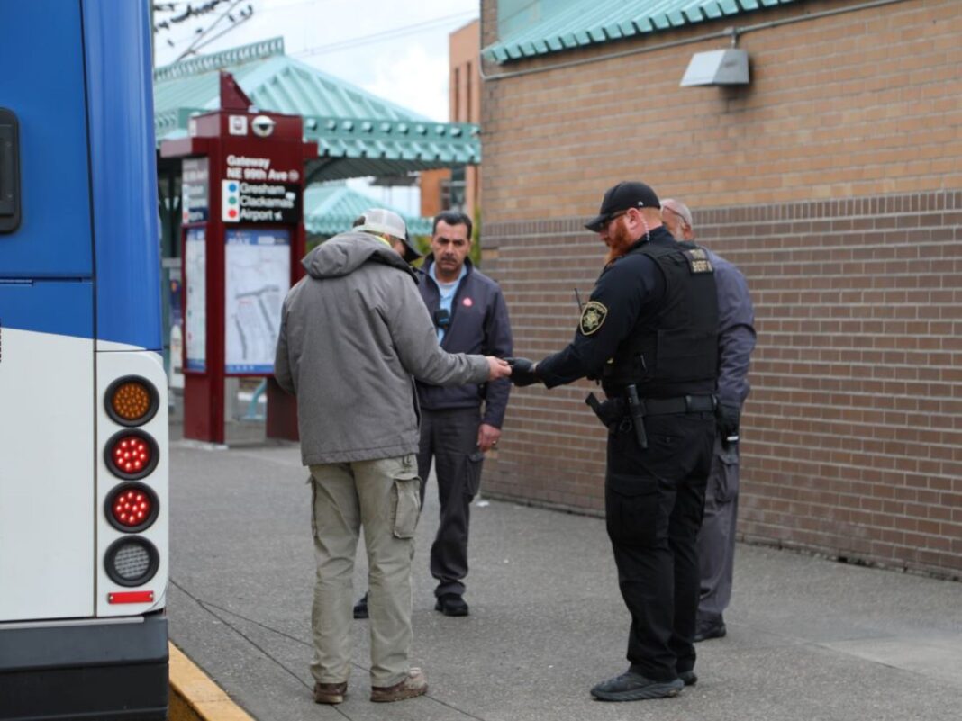 deputy and trimet employees talking to customer