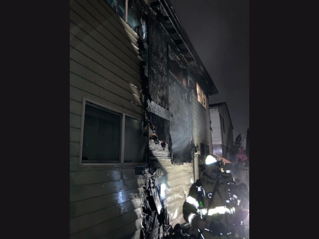 side of burned building in apartment fire