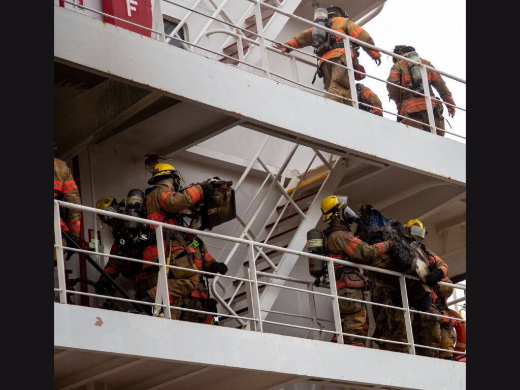 firefighters cleaning up after the fire