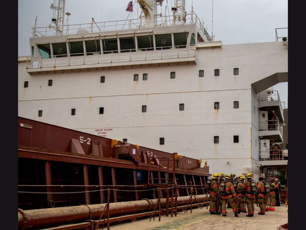 firefighters meeting on the deck of Breeze