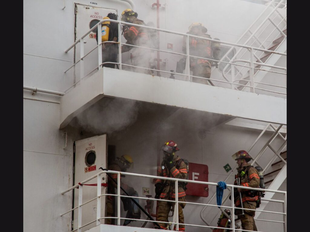 firefighters on the deck with the fire