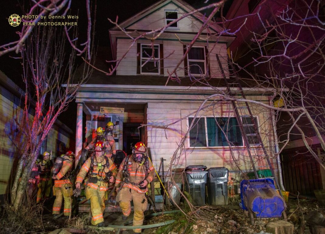 firefighters exiting the house