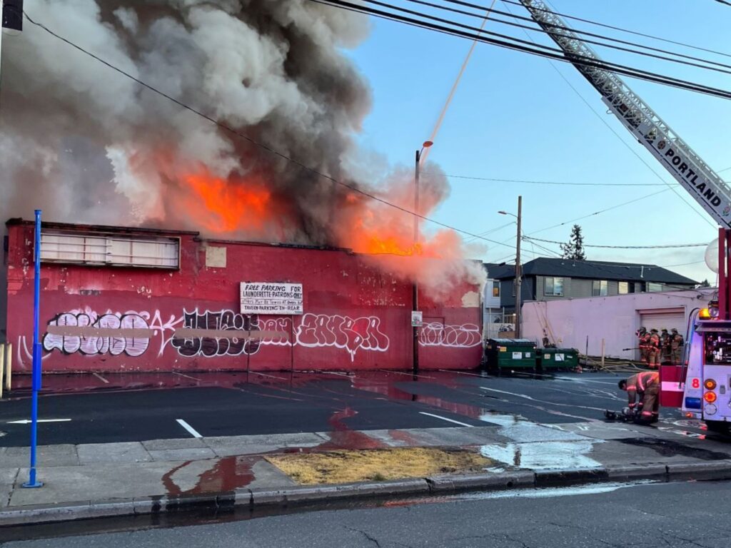 firefighters fighting the fire at Barn Tavern