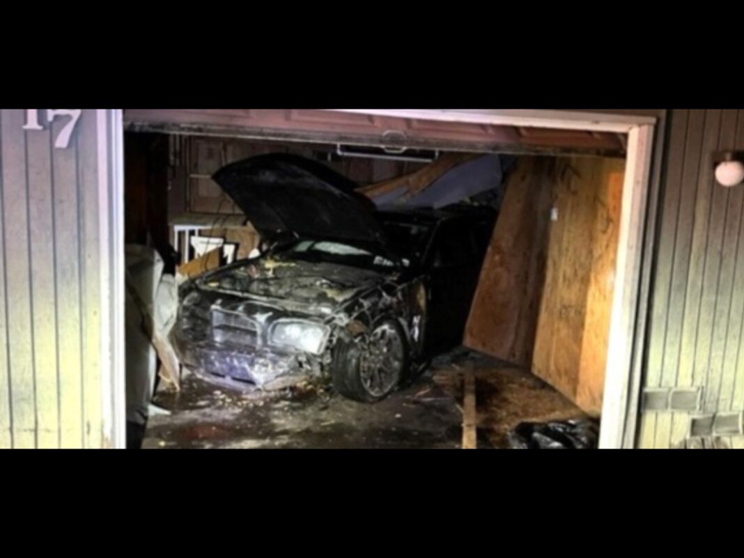 suspect eluding police crashes into garage building