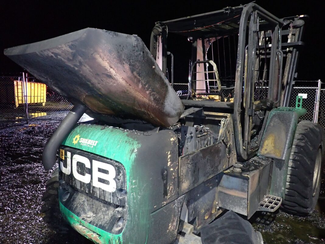 excavator after being set on fire and ruined