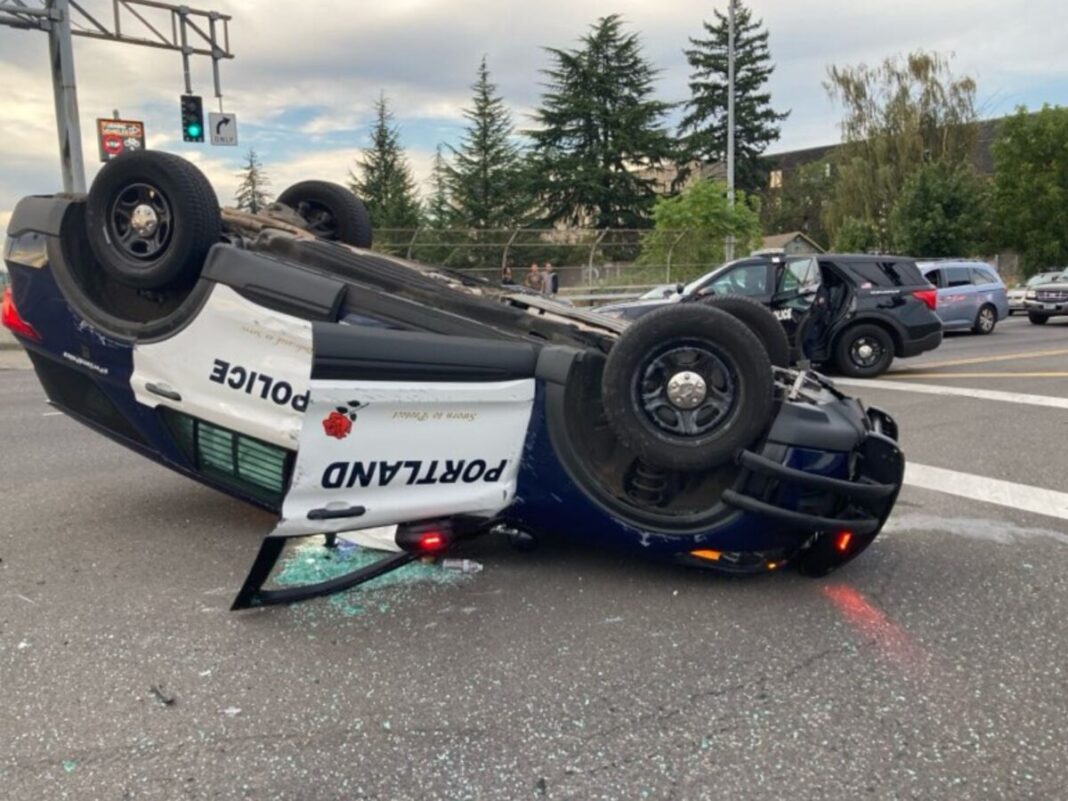 portland police cruiser flipped over